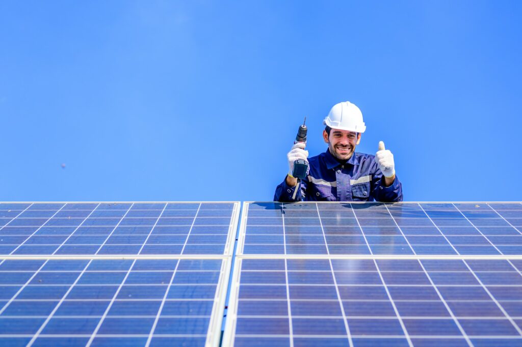 Solar panel station, Engineer installing solar panel at solar energy farm field